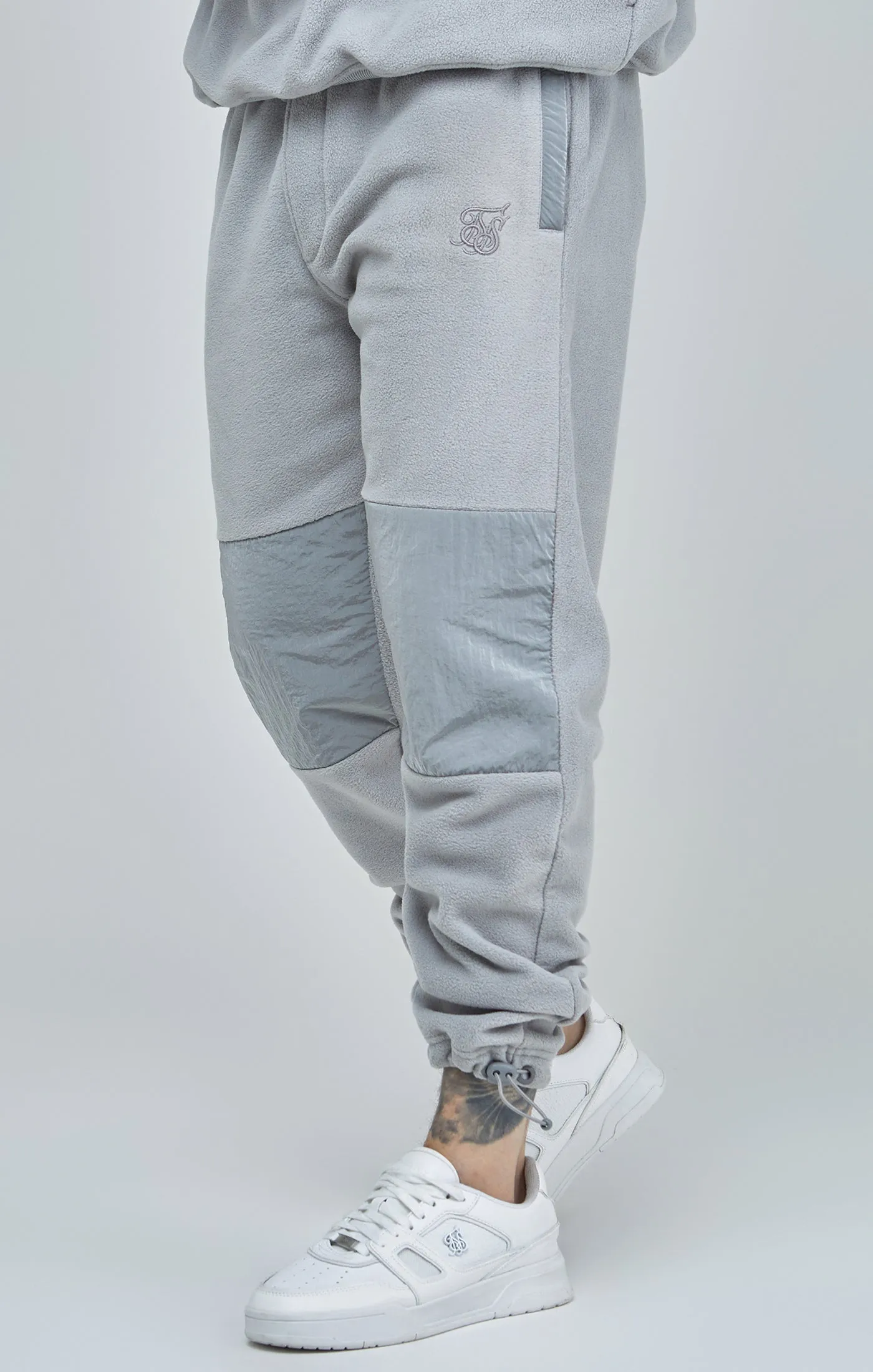 Grey Polar Fleece Panelled Cuffed Jogger sold by Siksilk