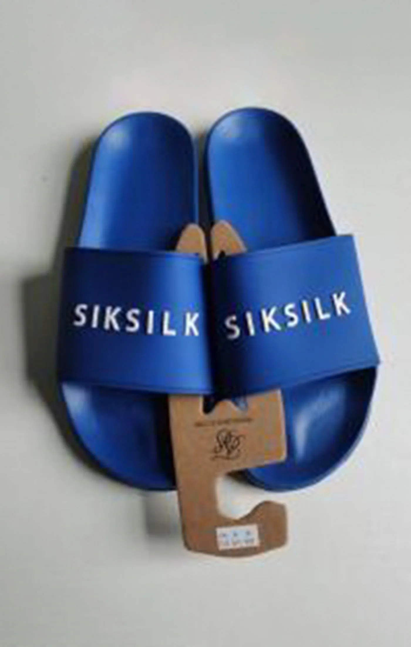 Blue Raised Branded Slider sold by Siksilk