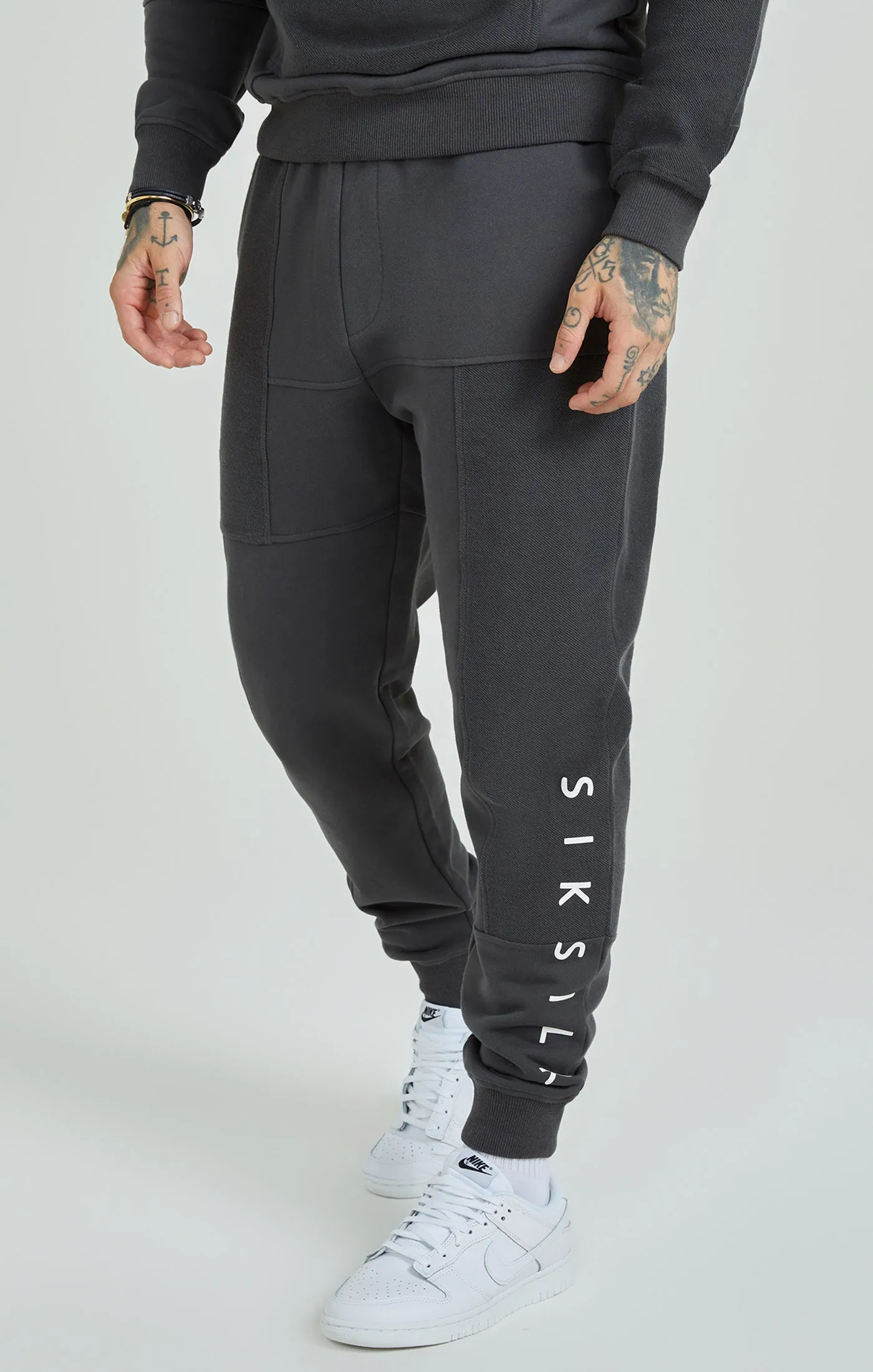 Dark Grey Cut & Sew Joggers sold by Siksilk