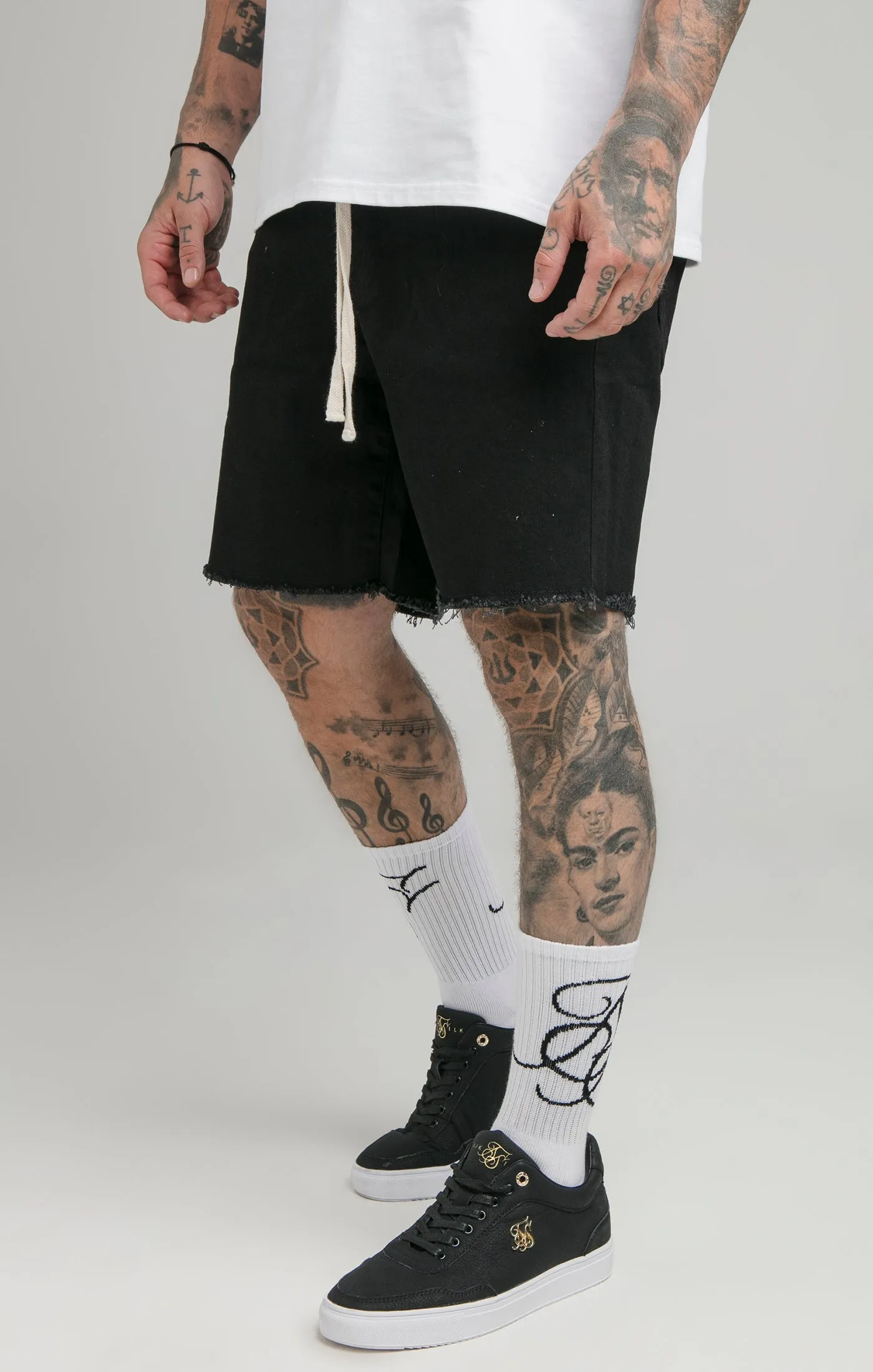 Black Raw Hem Relaxed Denim Short sold by Siksilk