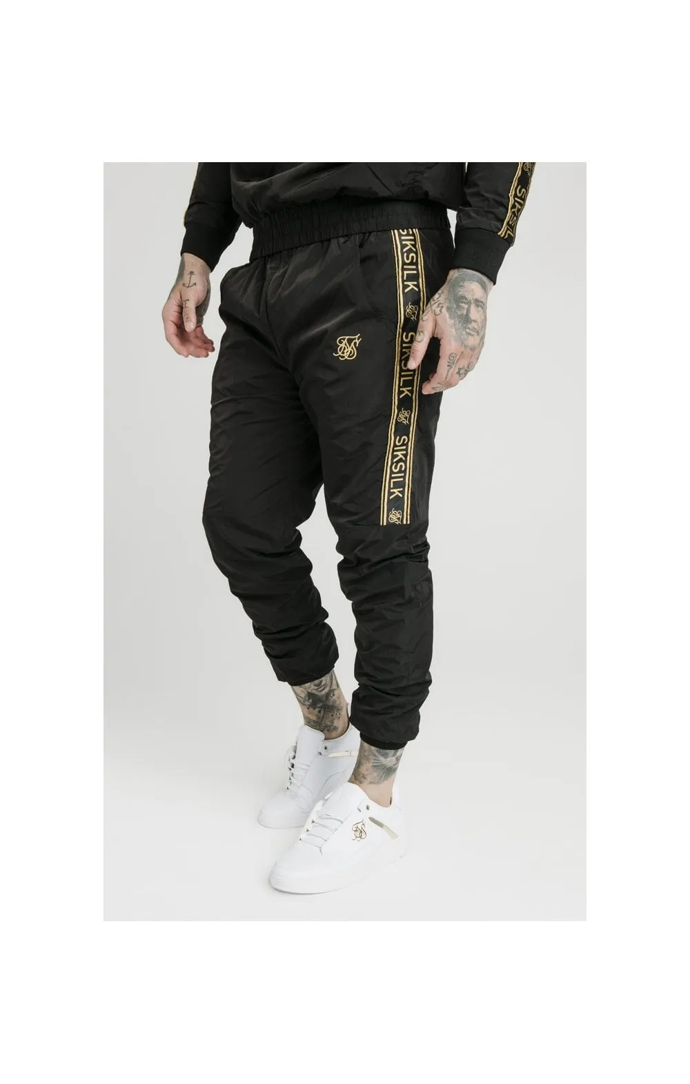 SikSilk Crushed Nylon Taped Joggers – Black & Gold sold by Siksilk
