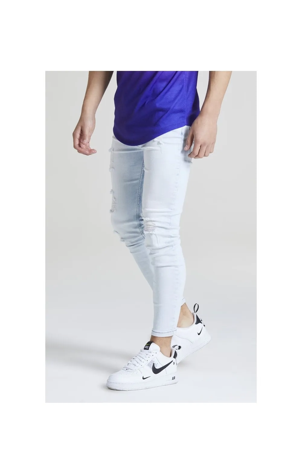 Illusive London Distressed Skinny Jeans – Light Wash sold by Siksilk