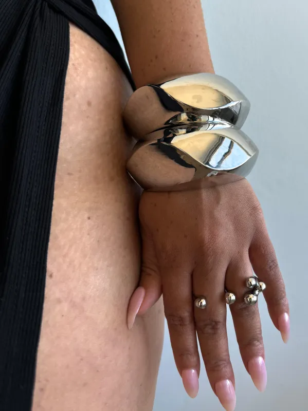 Chrome motion bangle sold by Rareify02