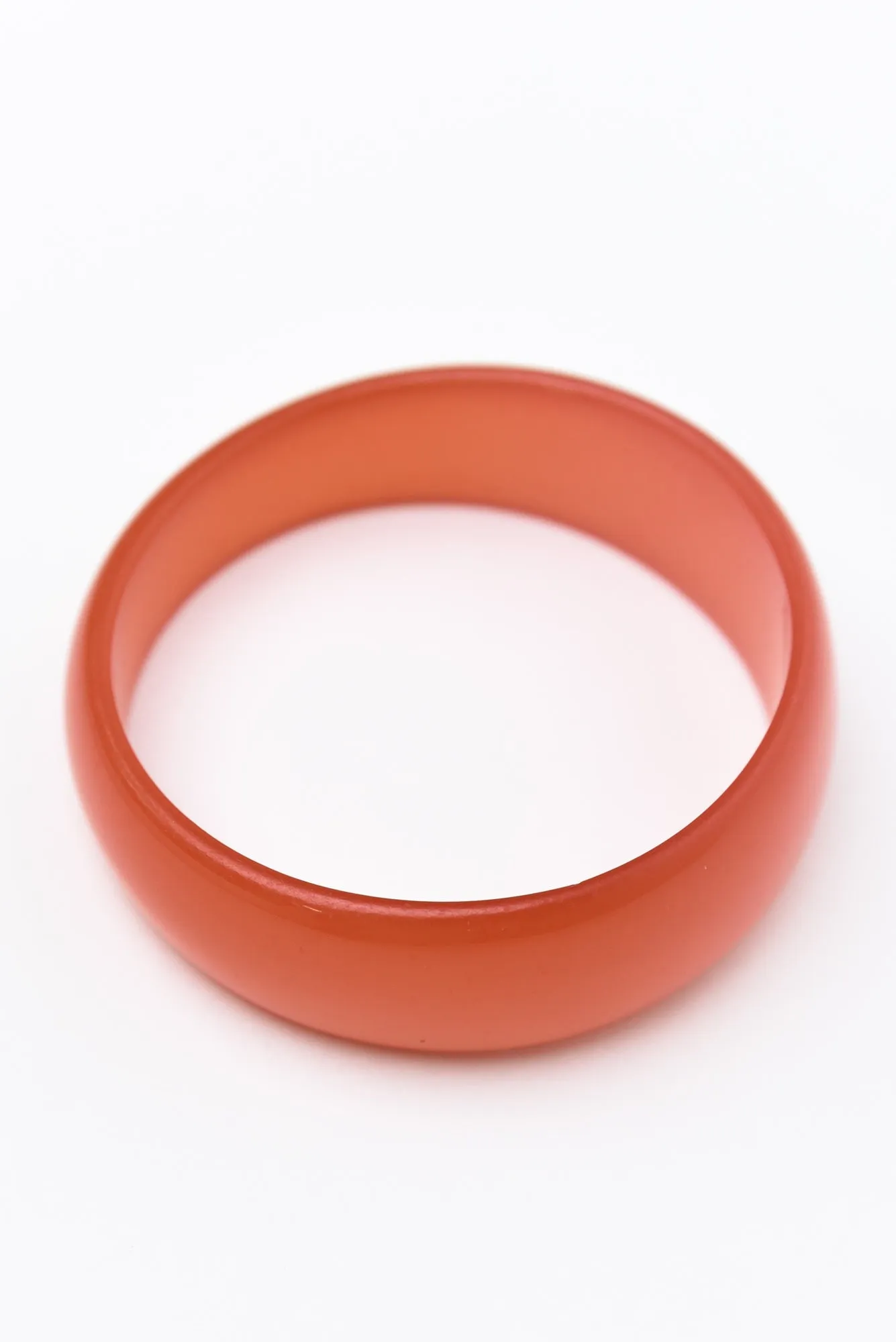 Cierra Orange Asymmetric Bangle sold by Blue Bungalow