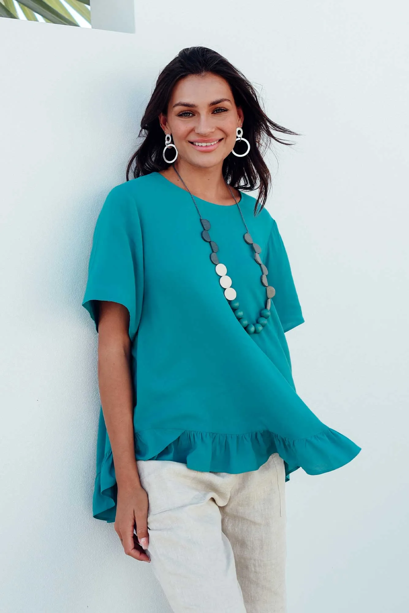 Cheryl Teal Frill Top sold by Blue Bungalow