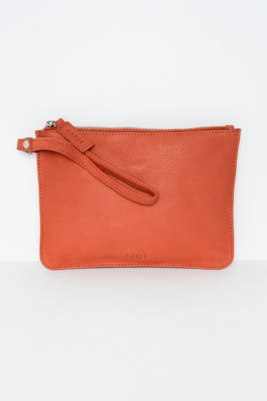Queens Coral Leather Clutch sold by Blue Bungalow