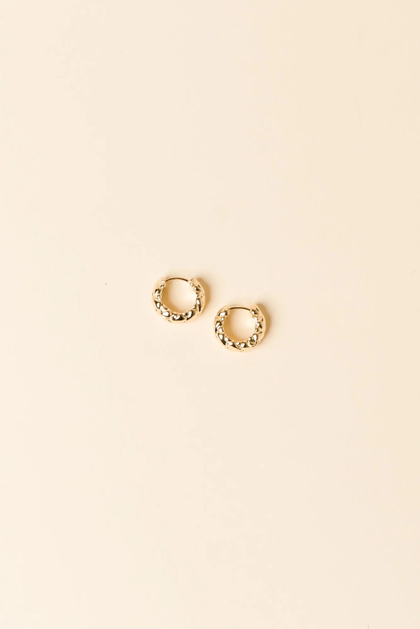 Macy Gold Huggie Earrings sold by Blue Bungalow
