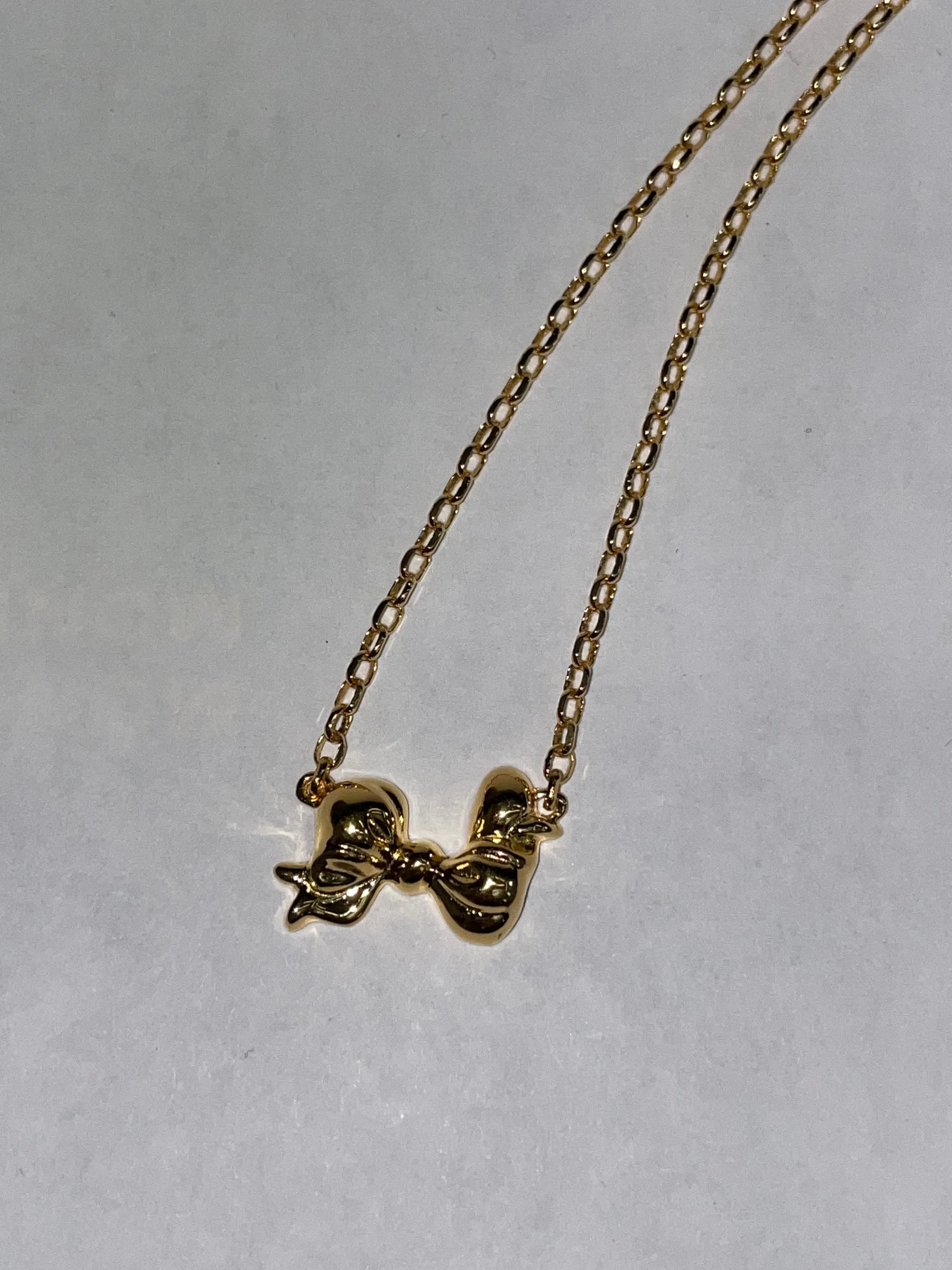 Archive Mini Bow Necklace in Gold sold by Mondo Mondo product image thumbnail 3