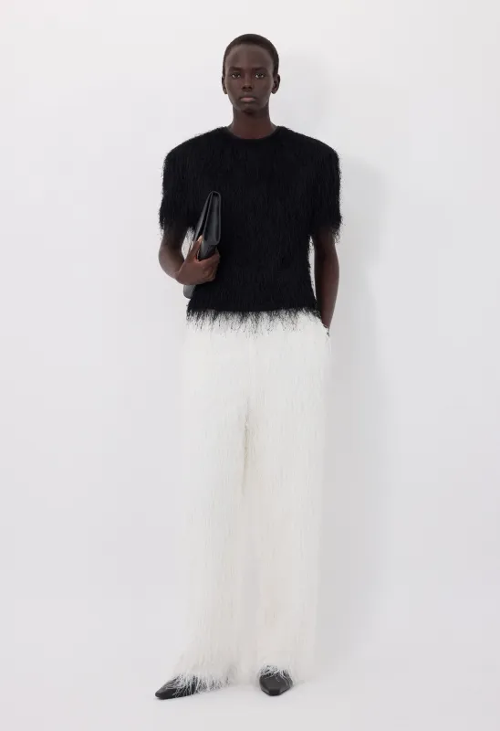 REED Fringed trousers made by Loulou De Saison
