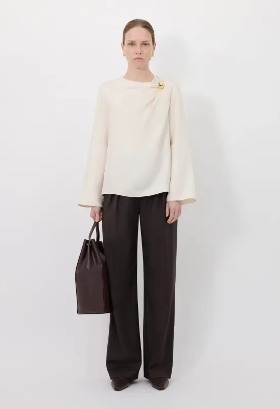 AZAE Draped silk top with metallic ornament sold by Loulou De Saison