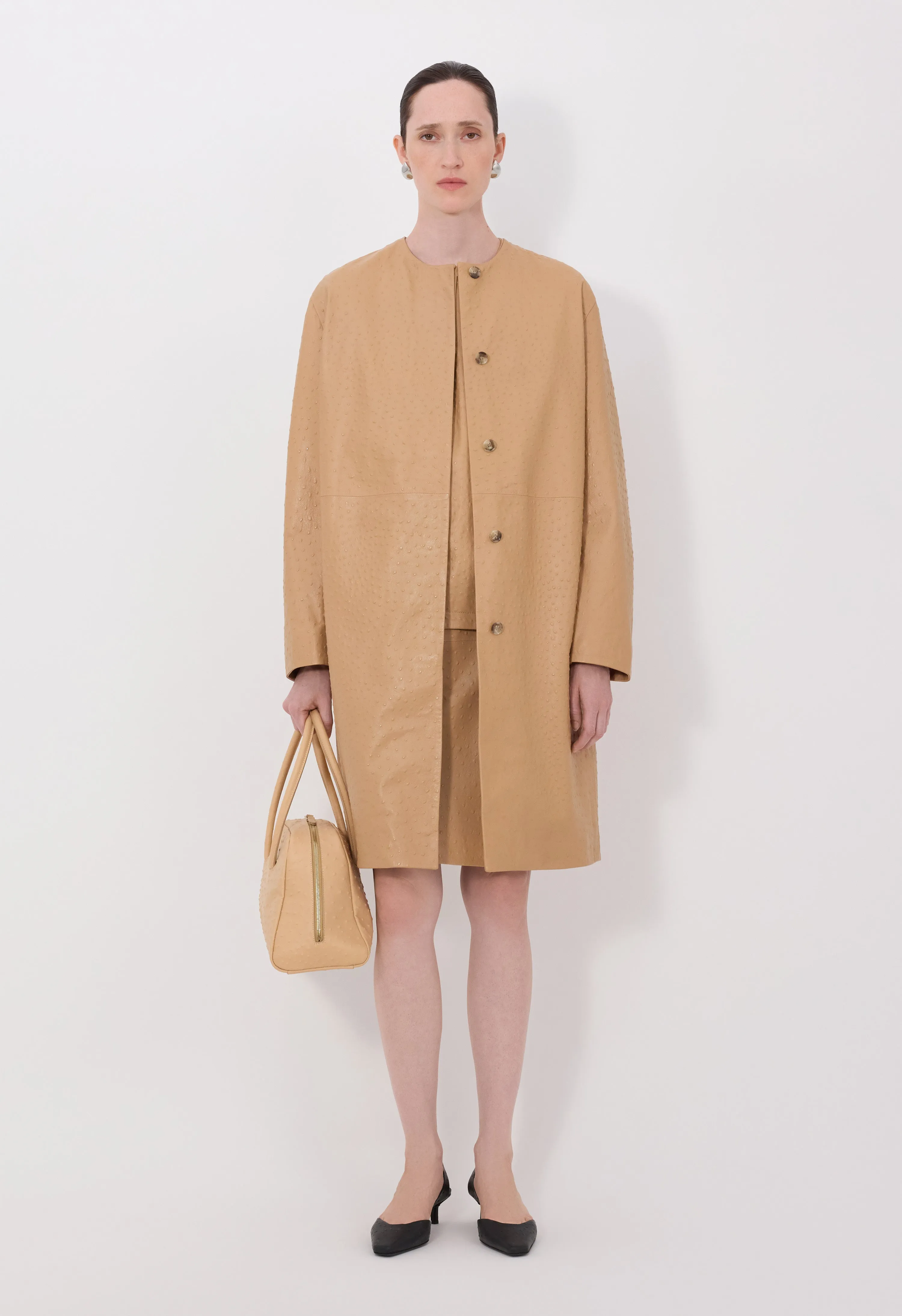 YARI Ostrich-effect leather coat sold by Loulou De Saison