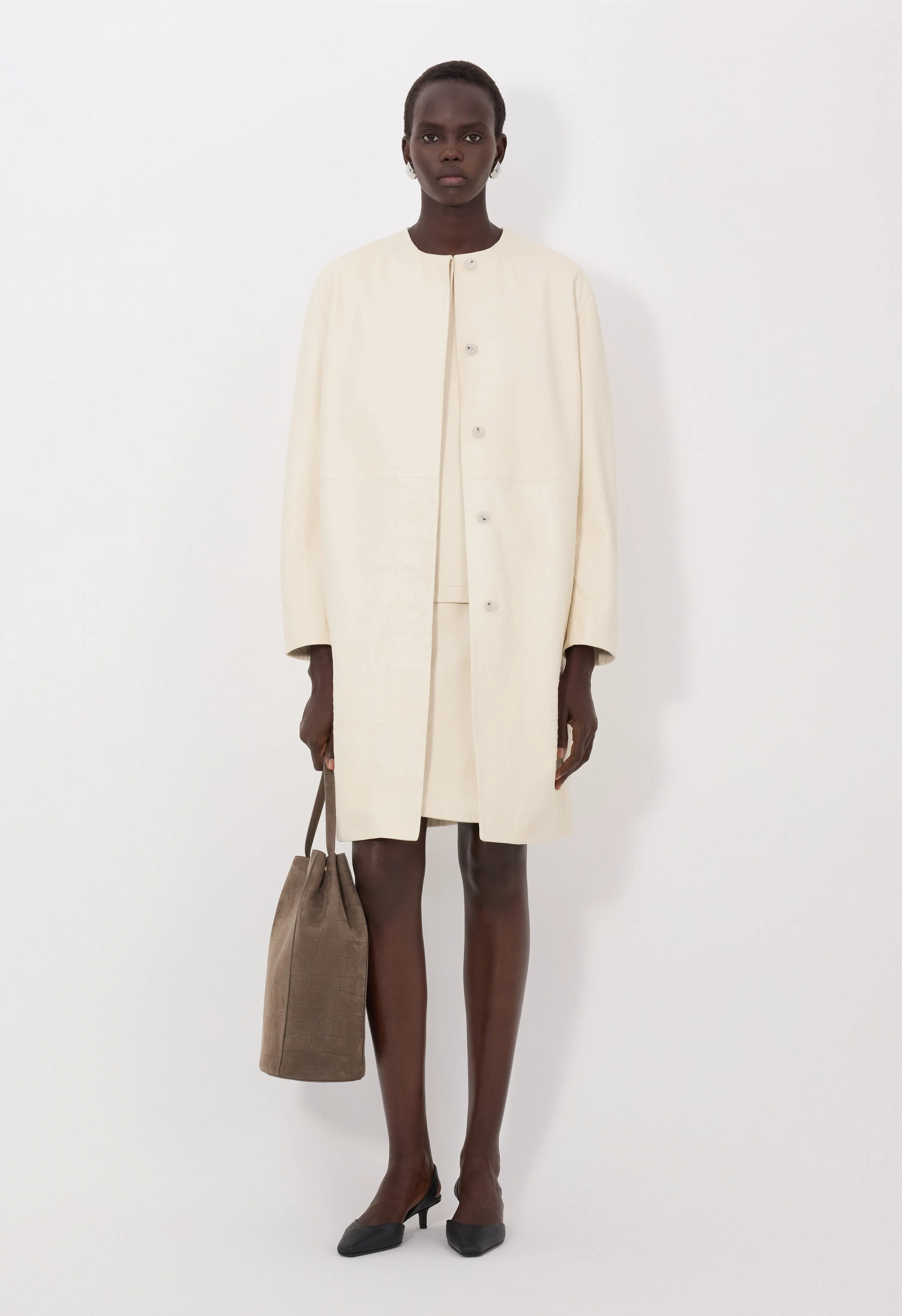 YARI Ostrich-effect leather coat sold by Loulou De Saison