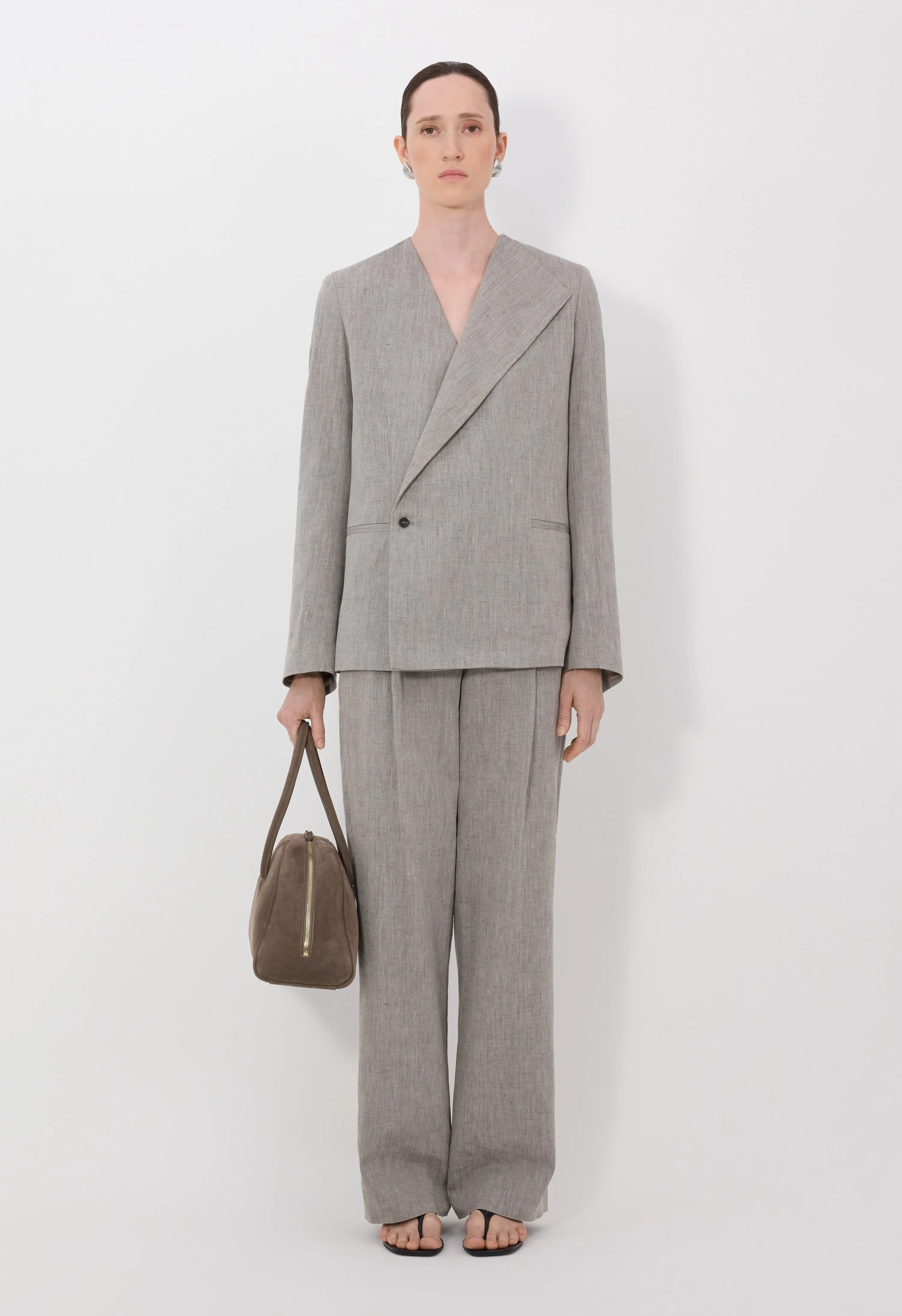 SUNA Asymmetric tailored jacket sold by Loulou De Saison