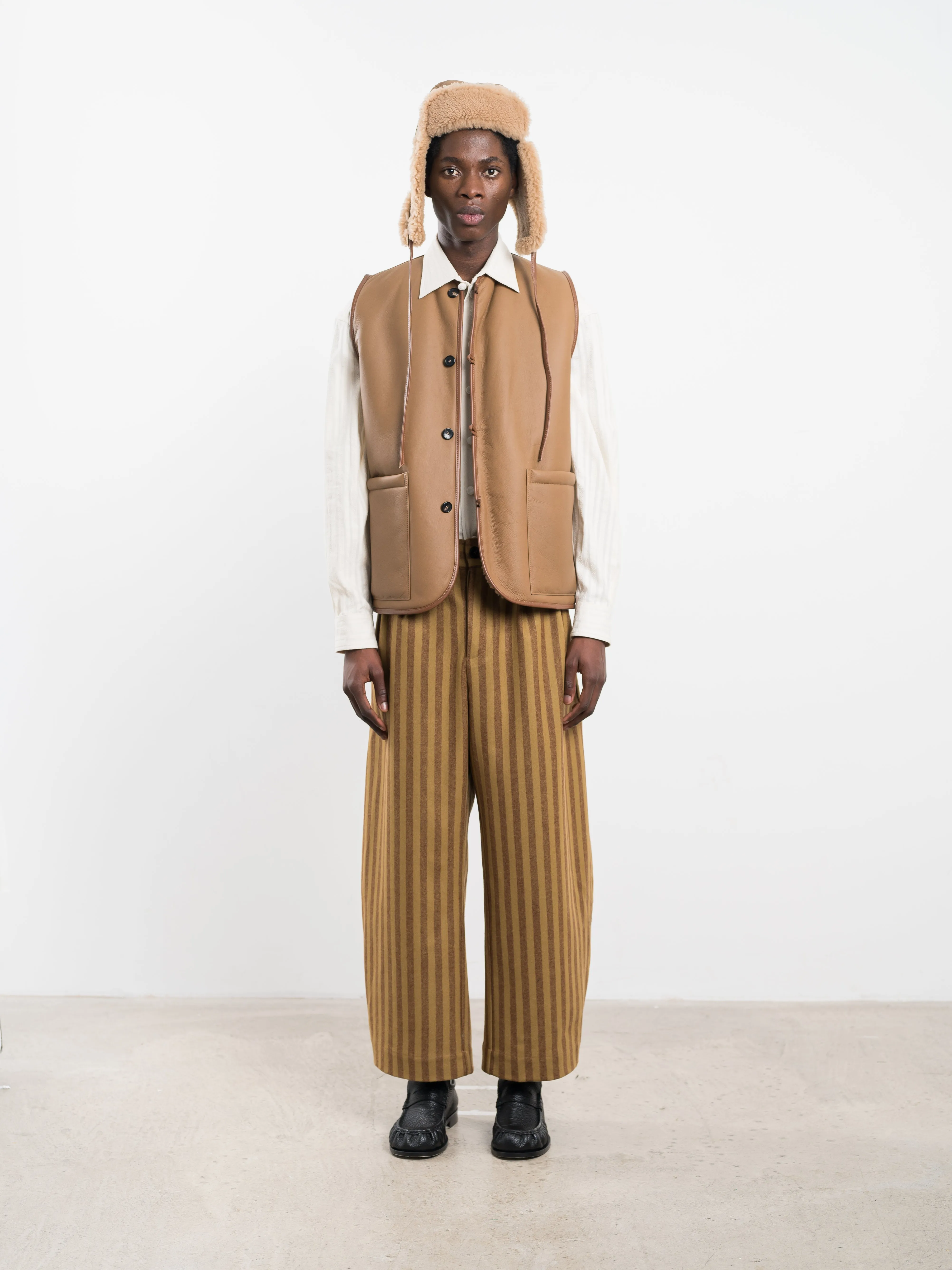 LEATHER BACK CURLY HAIR RIVER VEST sold by Cawley