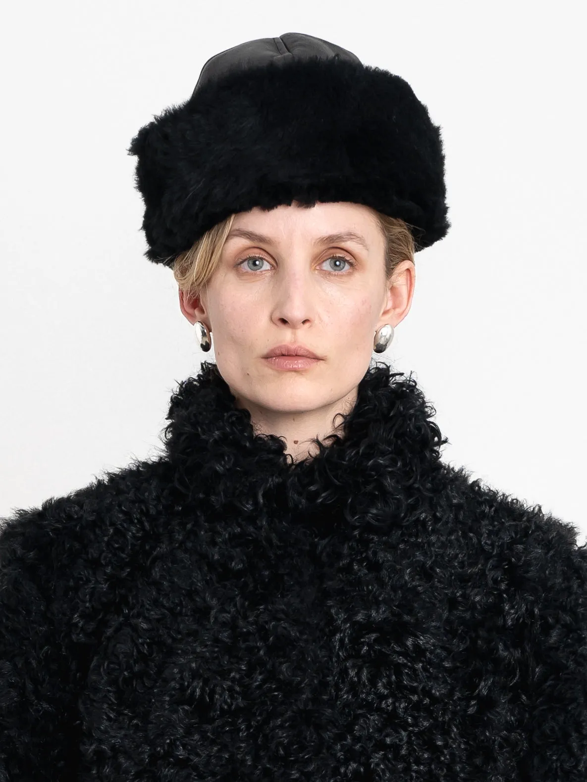 Leather Back Curly Hair Sheepskin Cap sold by Cawley