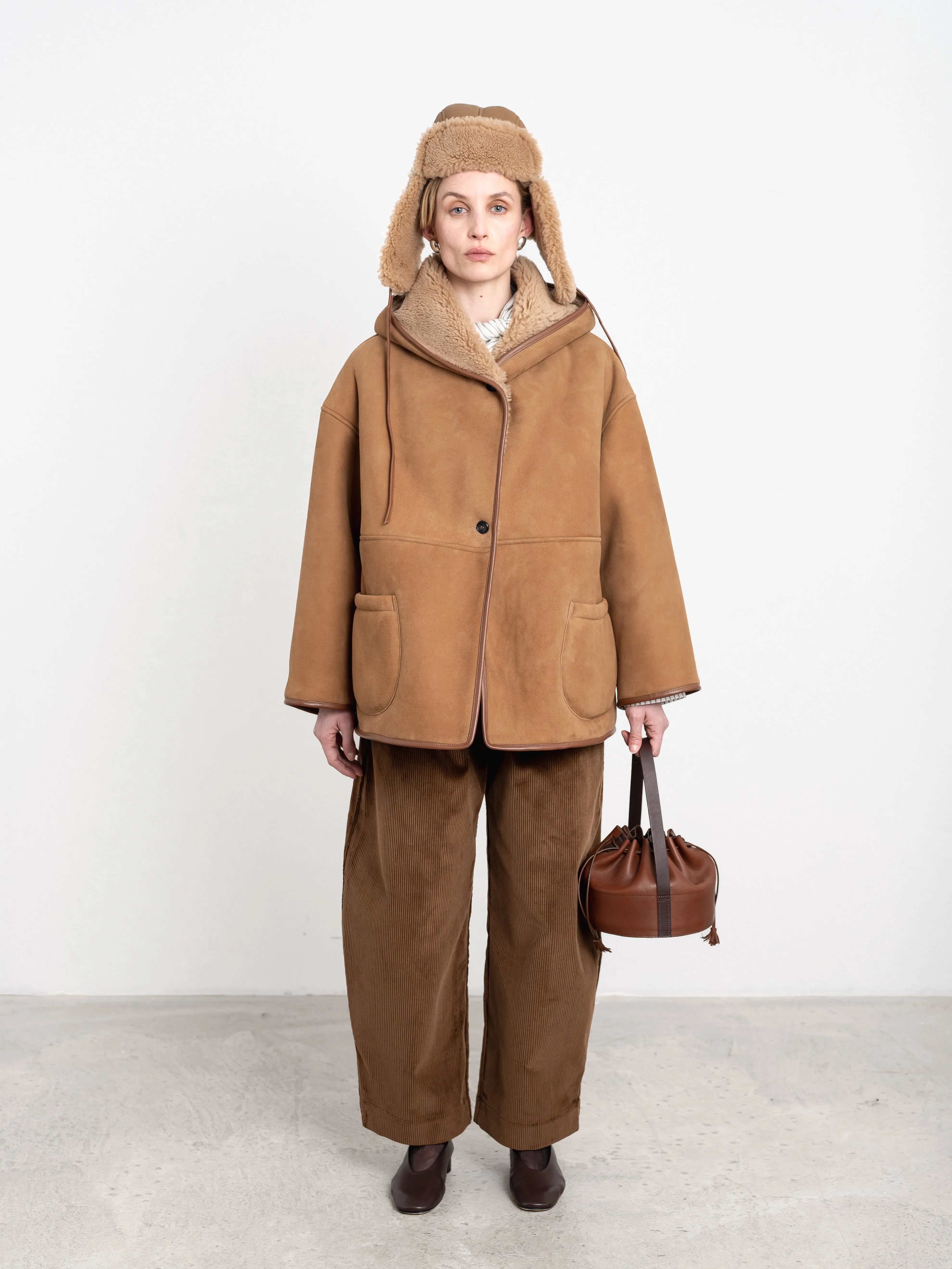 SUEDE BACK CURLY SHEEPSKIN REVERSIBLE HOLLAND COAT sold by Cawley