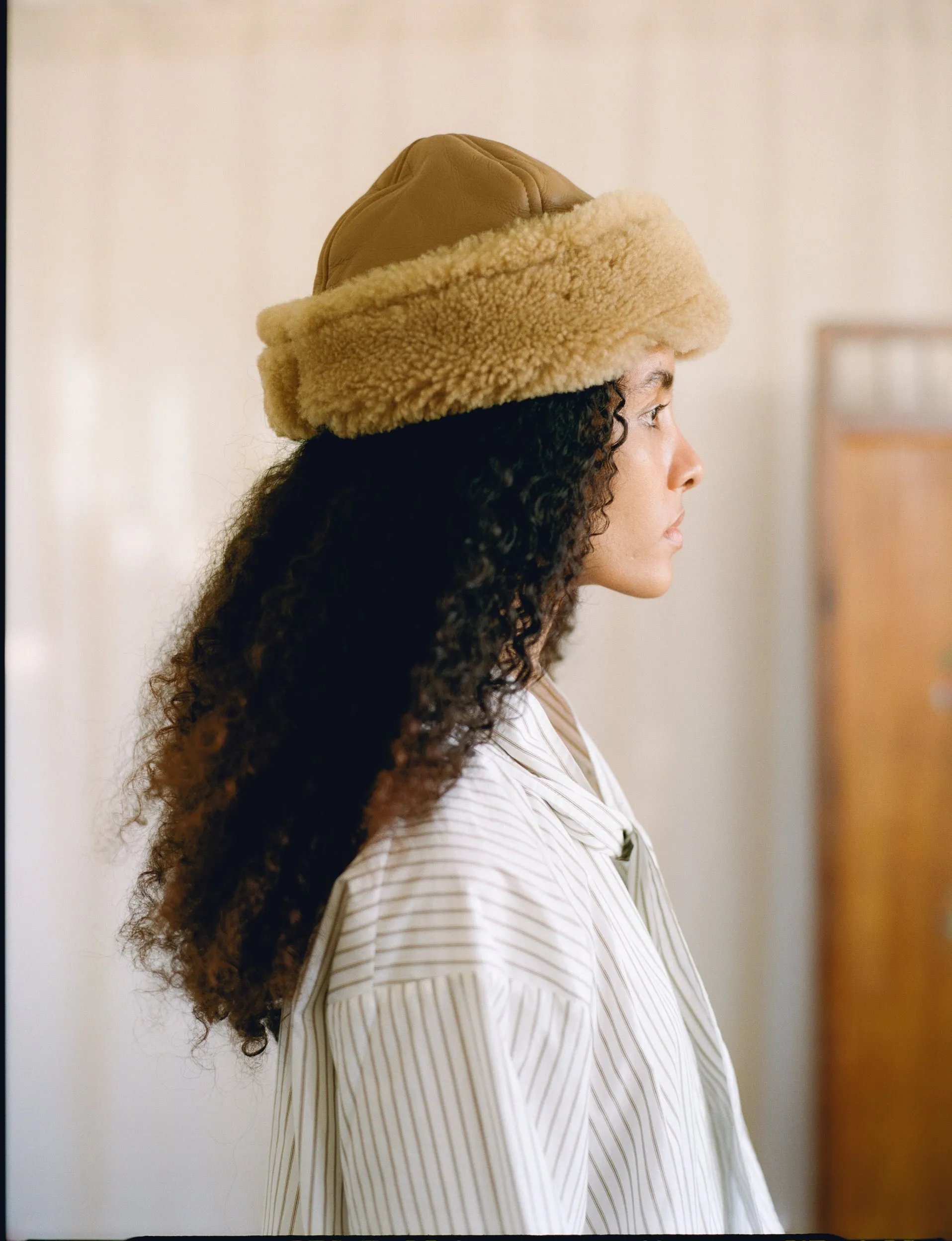 Tan Leather Back Curly Hair Sheepskin Cap sold by Cawley