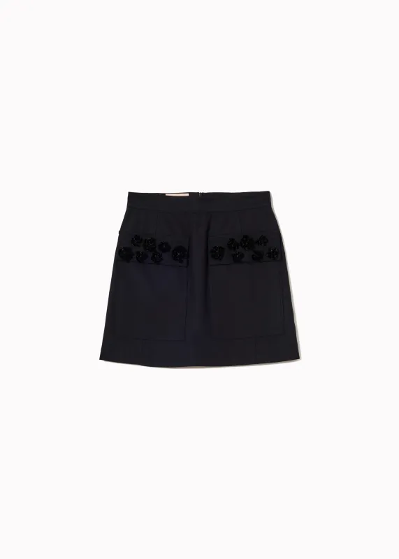 MINI SKIRT WITH EMBROIDERED POCKETS made by Plan C