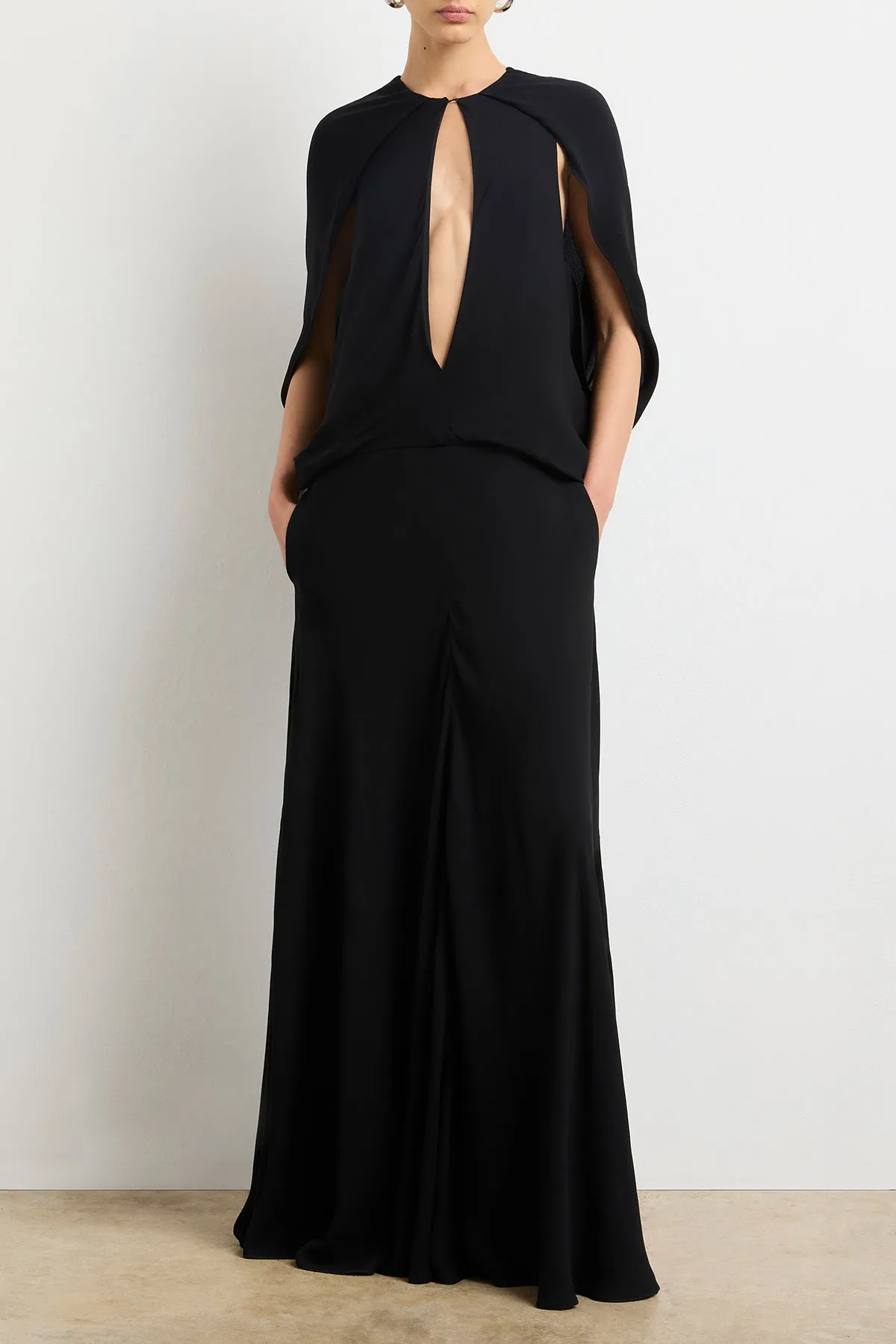 The Jillian Cape Dress in Black sold by Brandon Maxwell