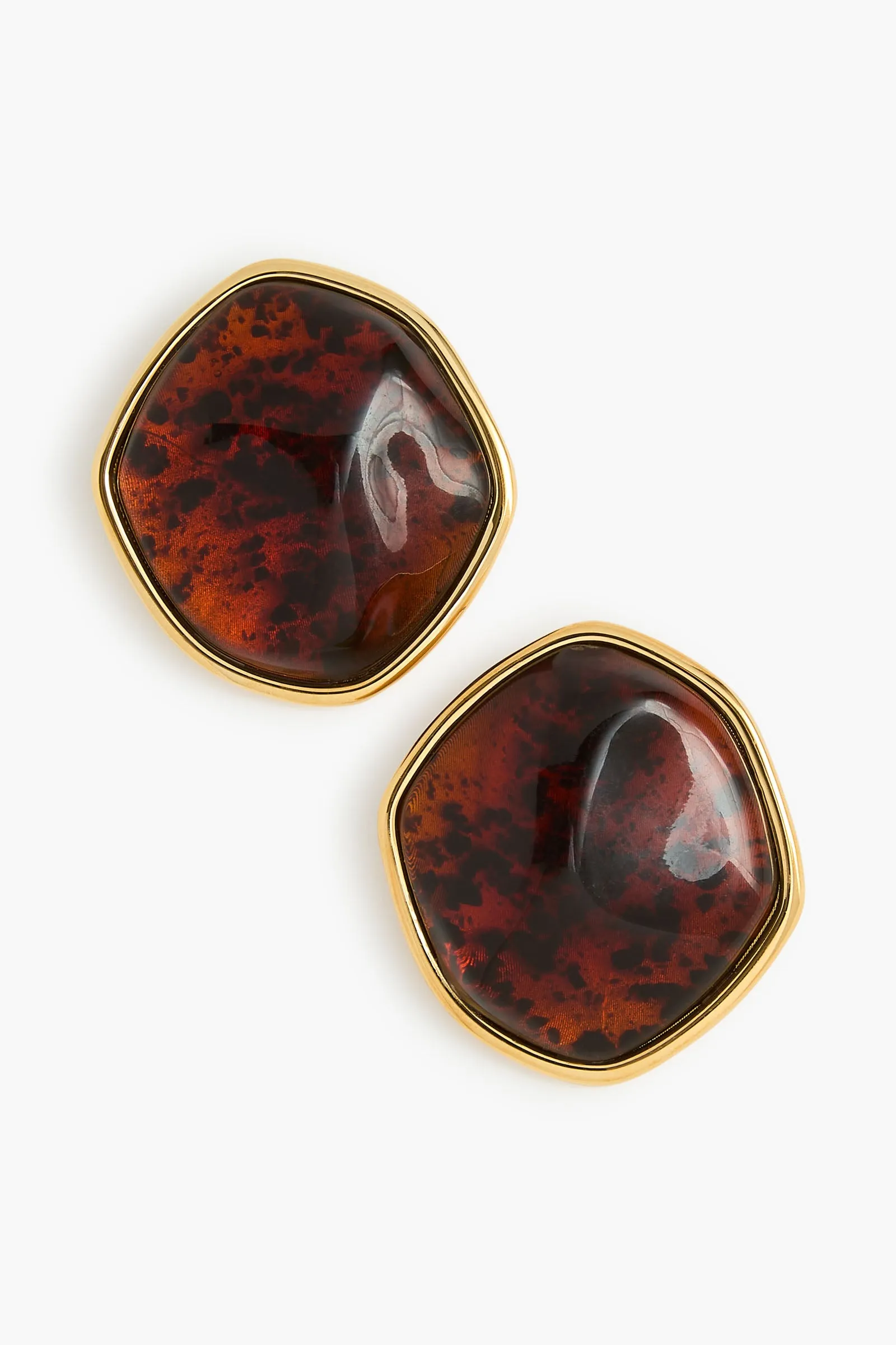The Resin Earrings in Amber and Gold sold by Brandon Maxwell