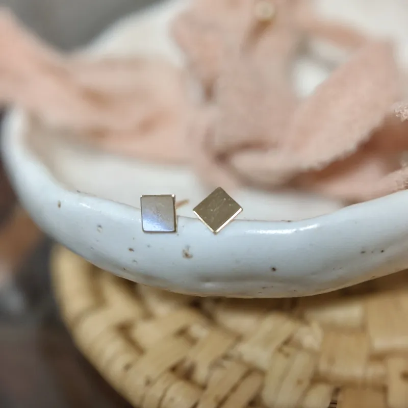 Square Studs sold by Vanderzee