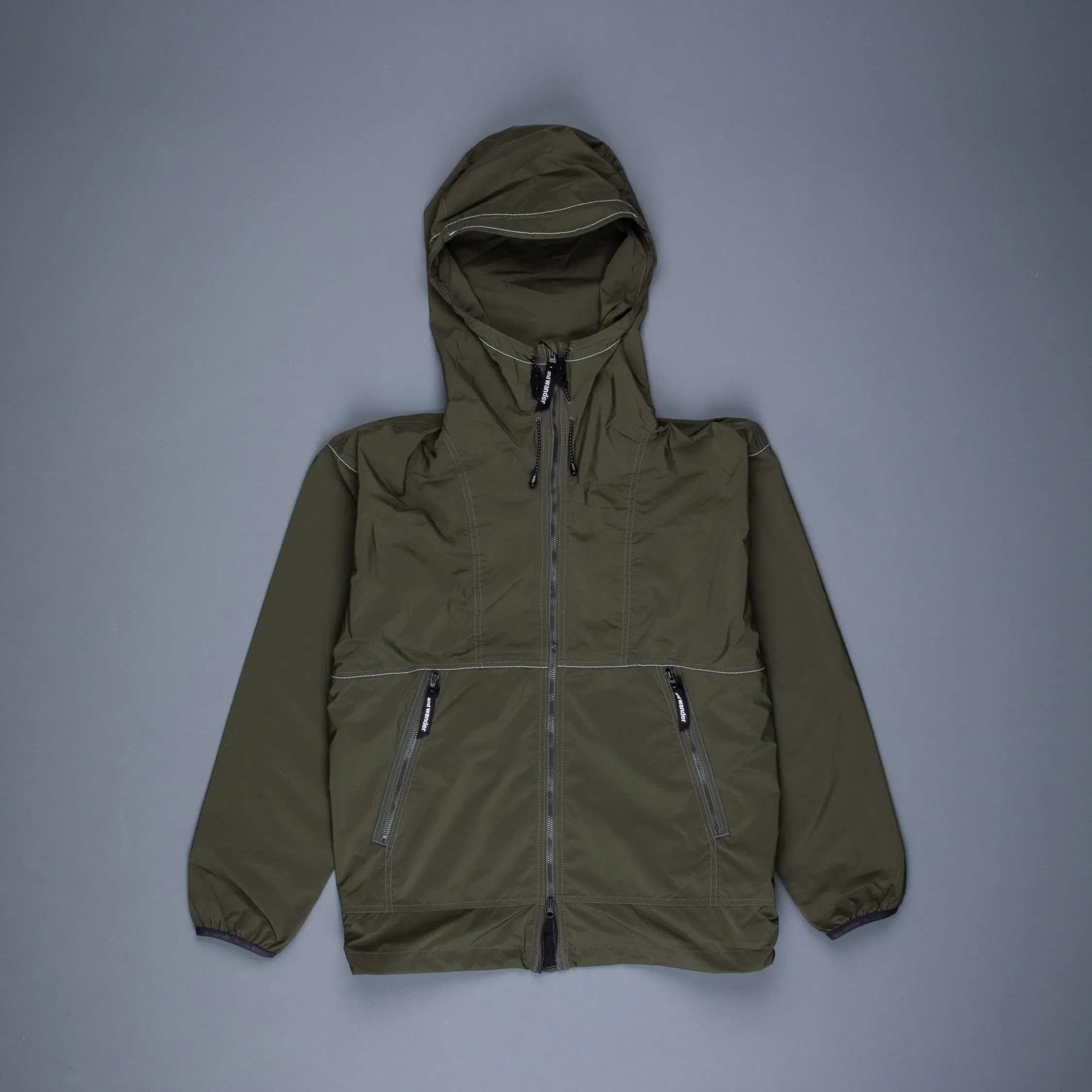 And Wander Pertex wind jacket khaki sold by Frans Boone