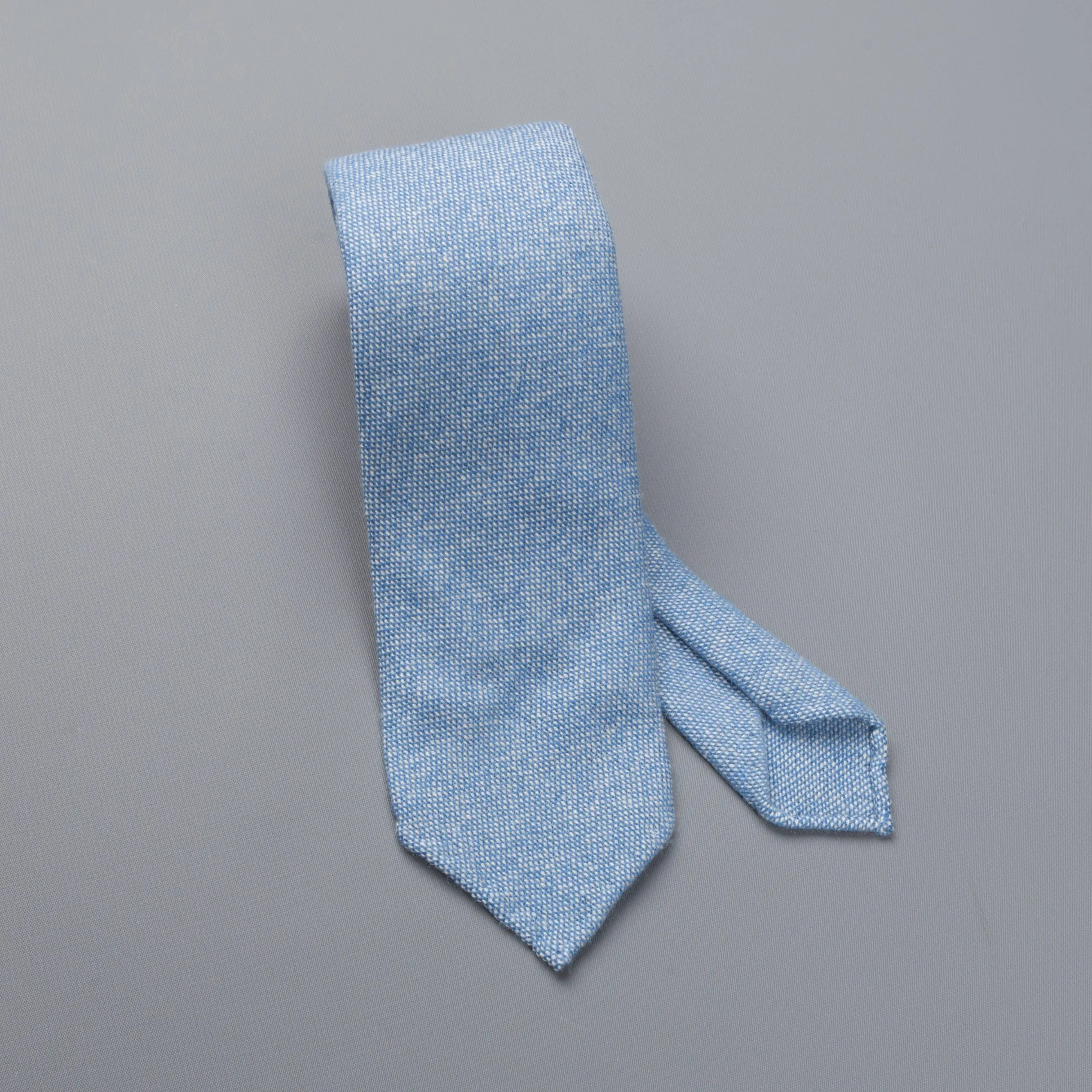 Drakes Cashmere tie, untipped light blue melange sold by Frans Boone