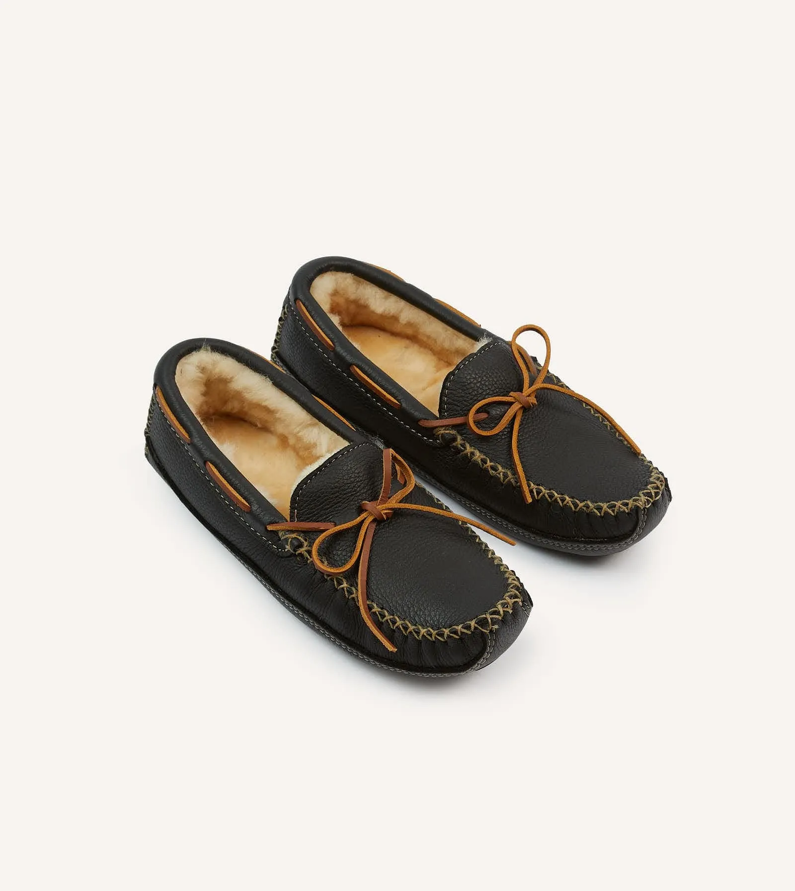 Minnetonka Black Sheepskin Lined Moose Slipper sold by Drake's London