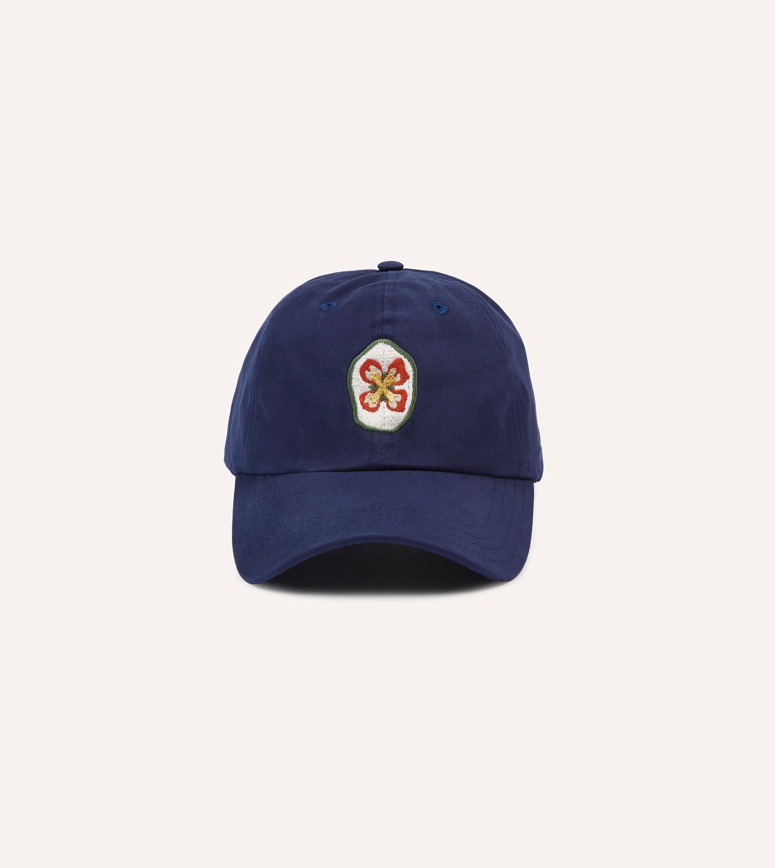 Navy Flower Emblem Cotton Baseball Cap sold by Drake's London