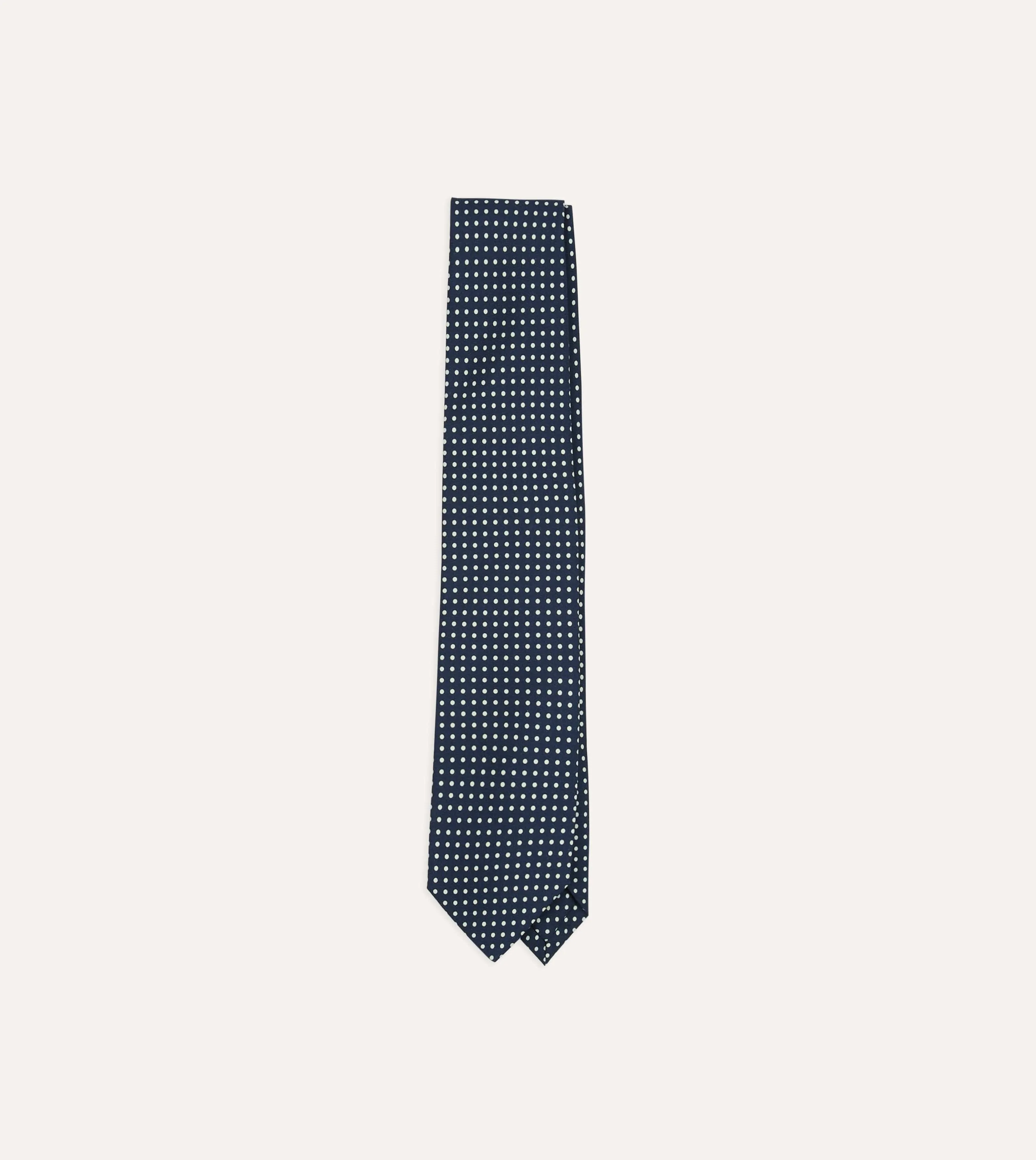 Navy Small Spot Silk Self-Tipped Tie sold by Drake's London