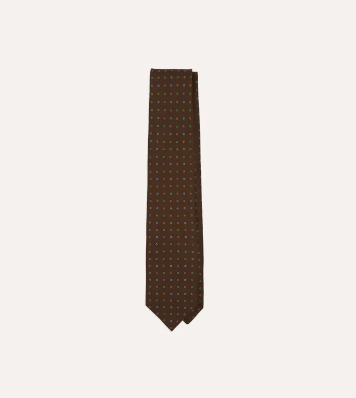 Brown Geometric Flower Print Silk Self-Tipped Tie made by Drake's London