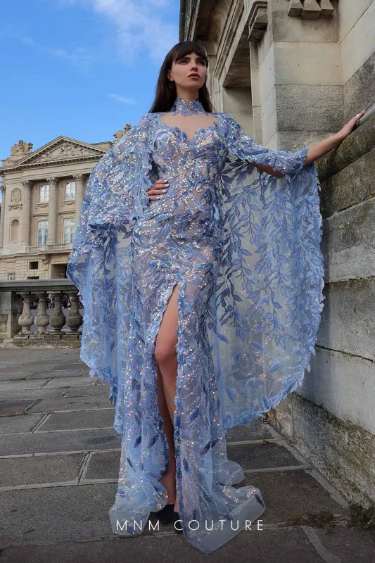 MNM Couture K4012 Blue Sheer Embellished Gown with Cape Sleeves made by MNM Couture