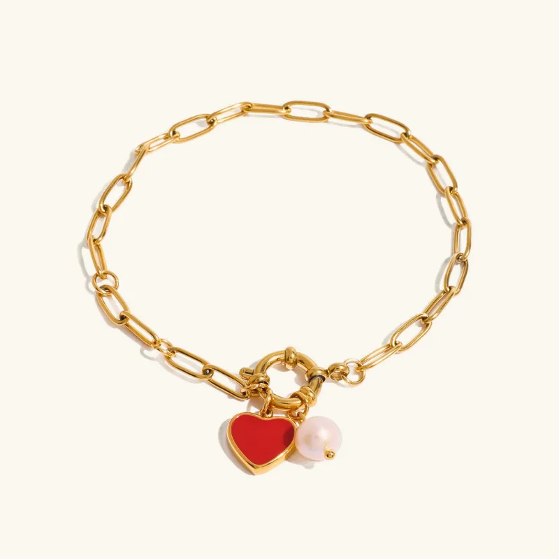 Women's Pearl Bracelet Gold Stainless Steel Heart Pendant sold by Hensley London