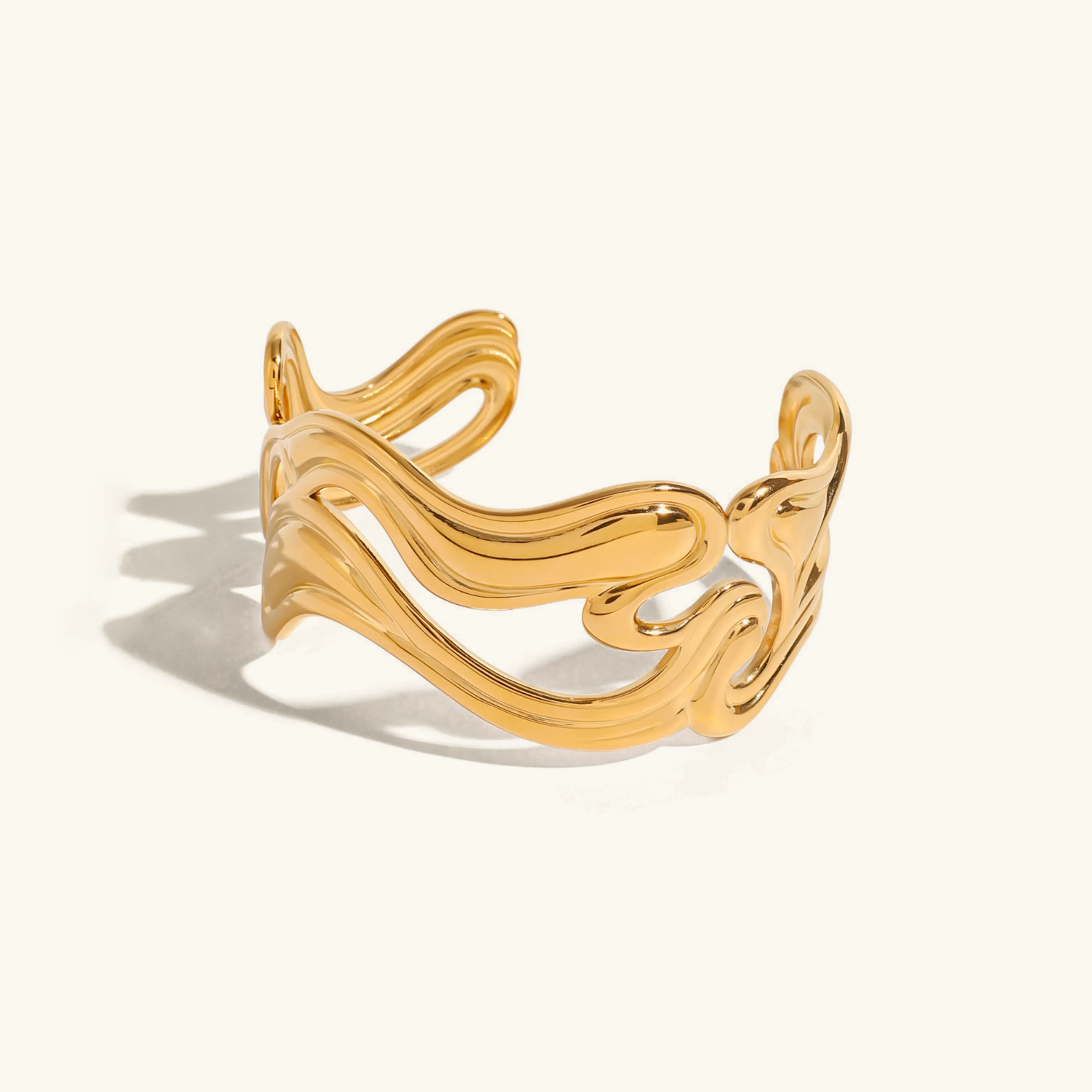 Women's Gold Bracelet Stainless Steel Open-Ended Wavy Design sold by Hensley London