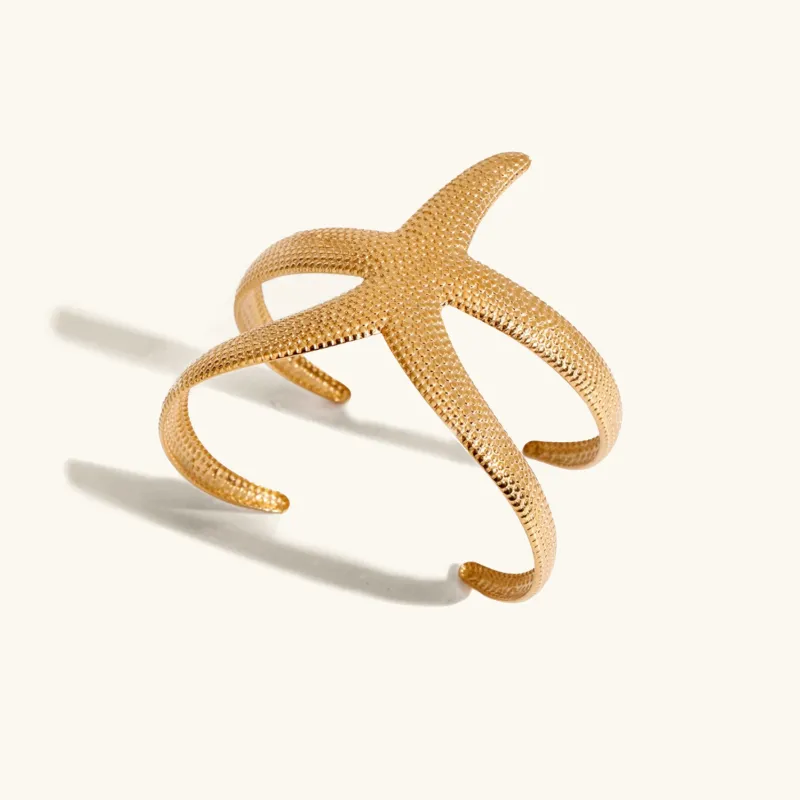 Women's Cuff Bracelet Gold Stainless Steel Starfish Design sold by Hensley London