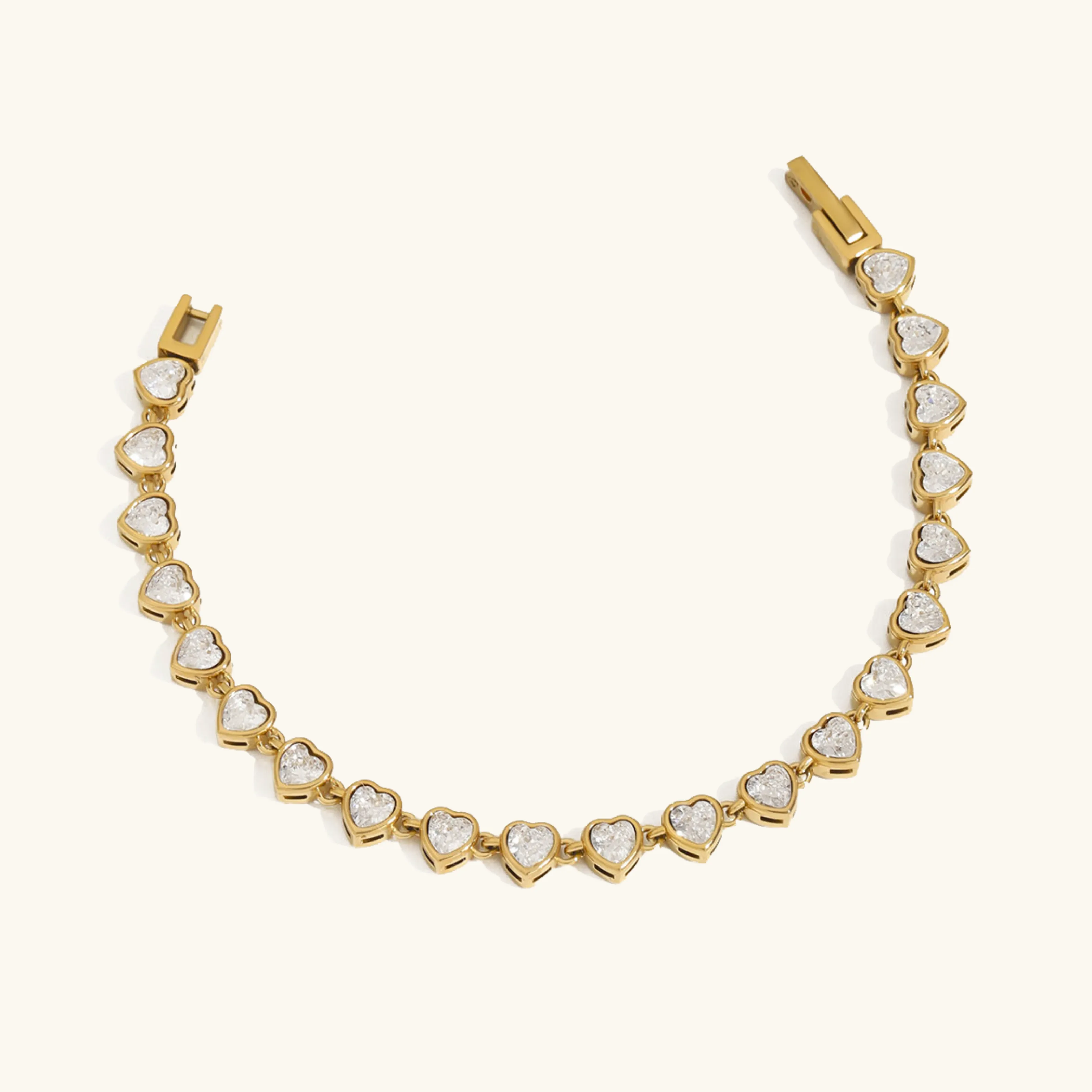 Women's Heart Shaped Tennis Bracelet Gold Stainless Steel sold by Hensley London