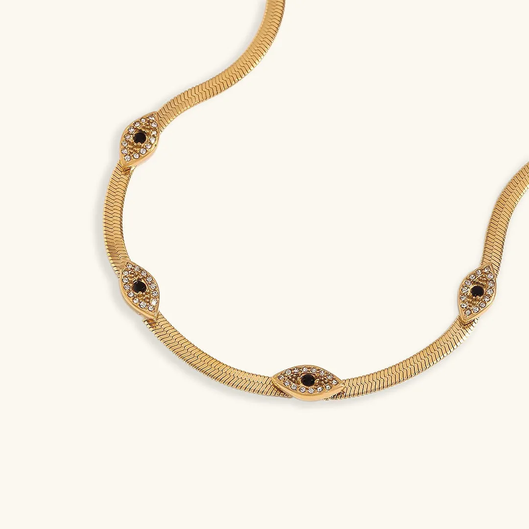 Exquisite 18k Gold Herringbone Necklace with Evil Eye Charms and Diamond Simulants sold by Hensley London