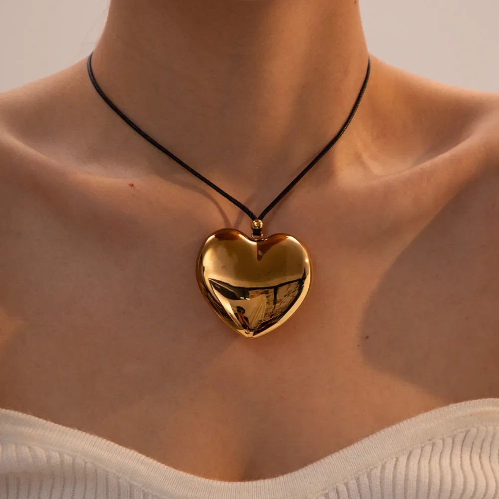 Chunky Gold Heart Pendant Necklace with Black Rope – Hypoallergenic and Waterproof Statement Jewelry for Women sold by Hensley London product image thumbnail 2