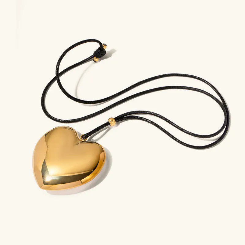 Chunky Gold Heart Pendant Necklace with Black Rope – Hypoallergenic and Waterproof Statement Jewelry for Women sold by Hensley London