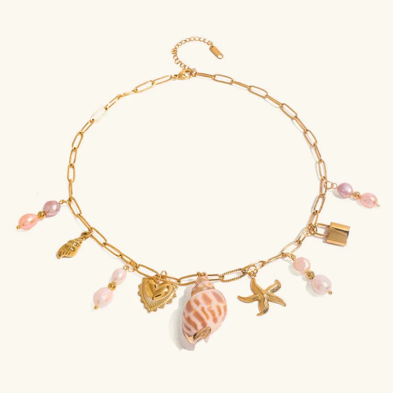 Elegant Gold Freshwater Pearl Necklace with Ocean-Inspired Charms – 16 Inch Adjustable Length sold by Hensley London