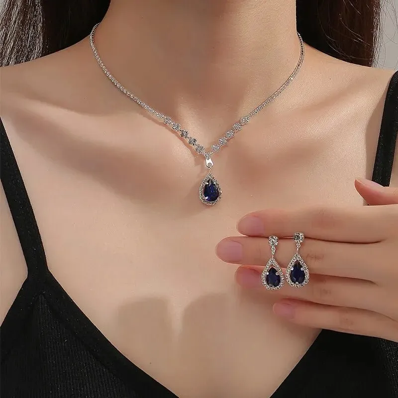 Elegant Blue Teardrop Jewelry Set – Necklace and Earring Set in Stainless Steel with Adjustable Length sold by Hensley London