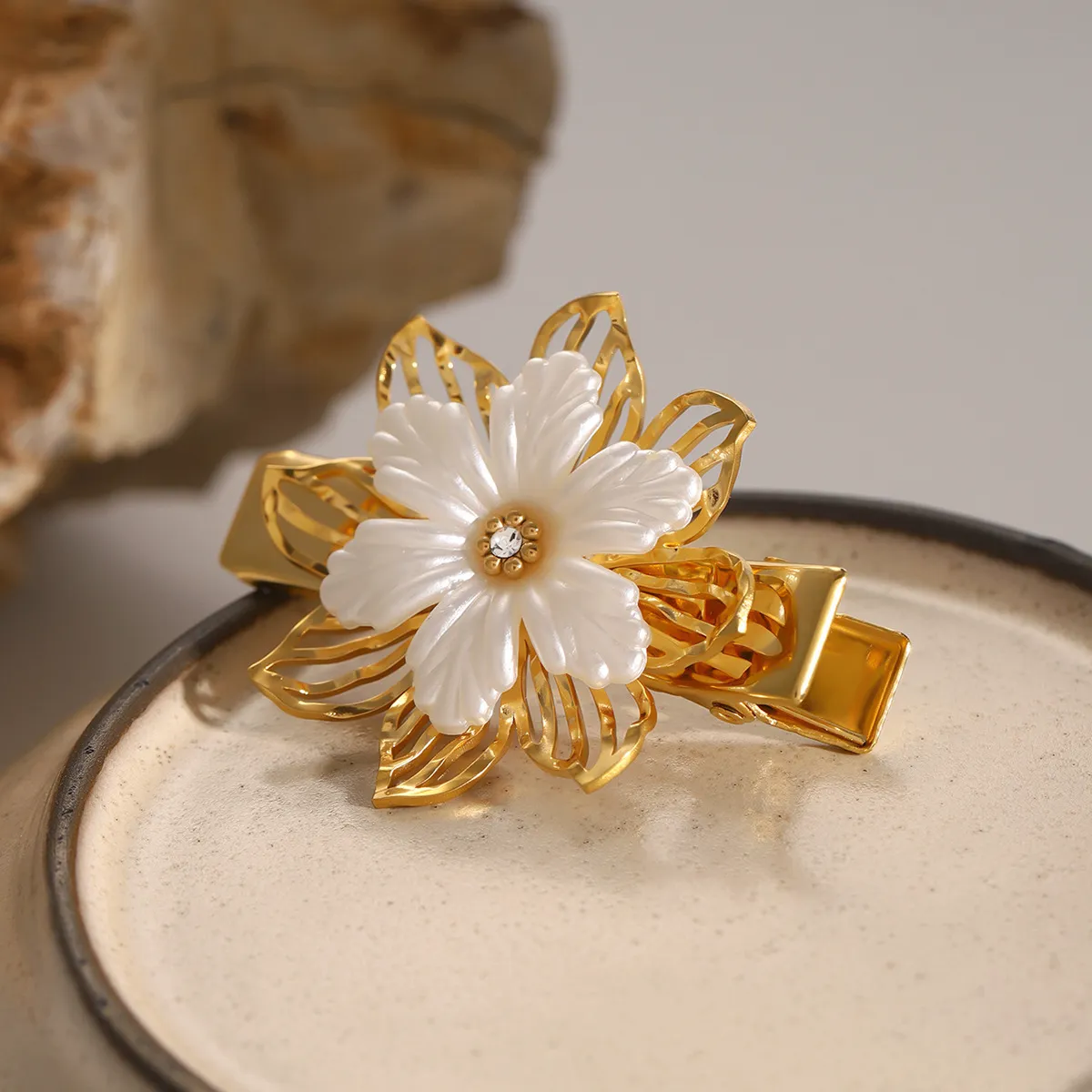 Elegant Floral Pearl Hair Clip – Gold Petal Design with Hypoallergenic Freshwater Pearl sold by Hensley London