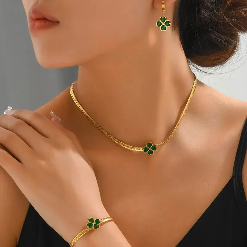 Emerald Four Leaf Clover Jewelry Set - Necklace and Earring Set with Bracelet, Gold Accents, and Modern Design sold by Hensley London