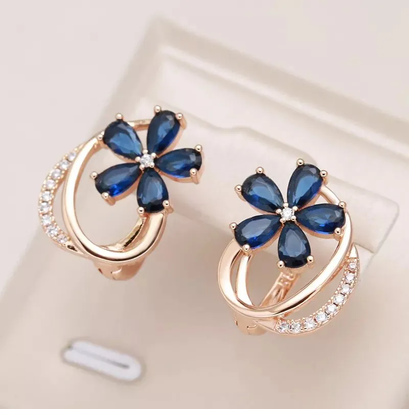 Gold Floral Earrings for Women with Blue Zircon Crystals – Elegant Five-Petal Design made by Hensley London