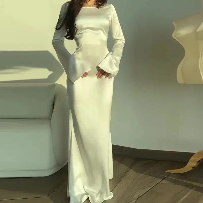 Women's Elegant Fitted Bodice Floor Length Maxi Dress with Long Flared Sleeves sold by Hensley London