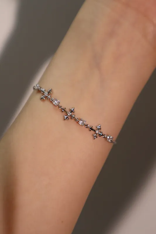 Women's Multi Diamond Cross Bracelet Silver Zirconia sold by Hensley London