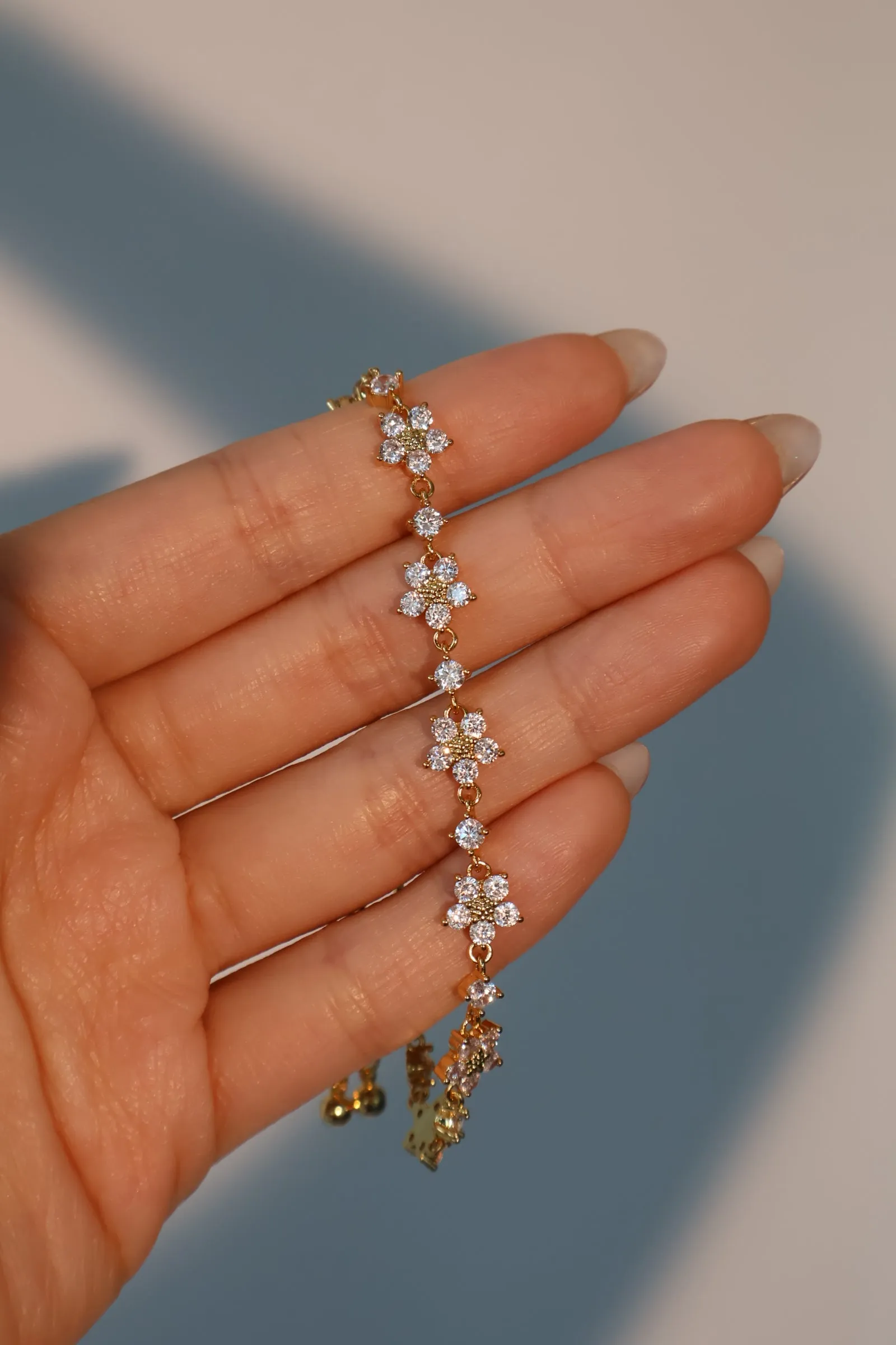 Women's Bracelet Gold Plated Zirconia Flower Design sold by Hensley London