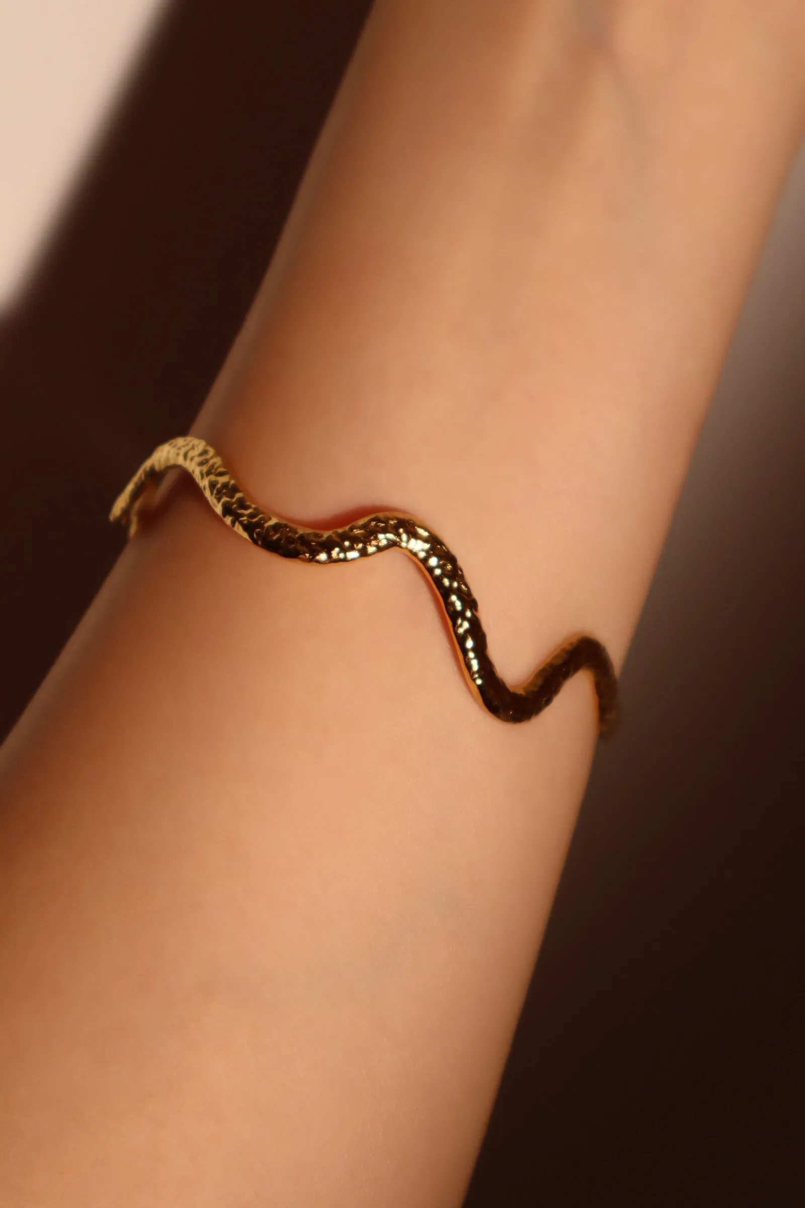 Women's Women's Wave Bracelet Gold Stainless Steel sold by Hensley London