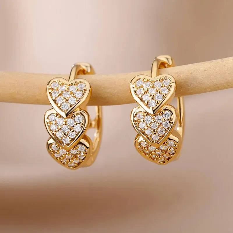 Women's Gold Hoop Earrings for Women with Heart Design and Diamond Accents made by Hensley London
