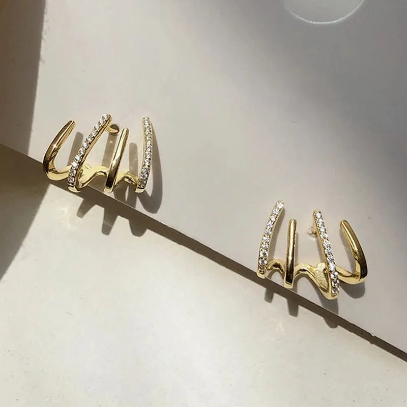 Women's Huggie Earrings Gold Stainless Steel Claw Design with Zircon made by Hensley London